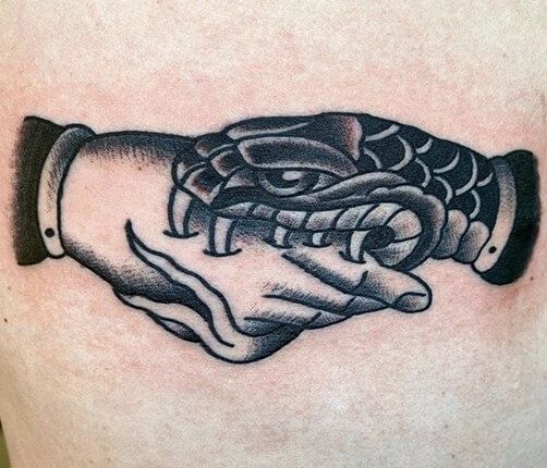 15+ Handshake Tattoo Designs: The Hand That Bites Tattoo